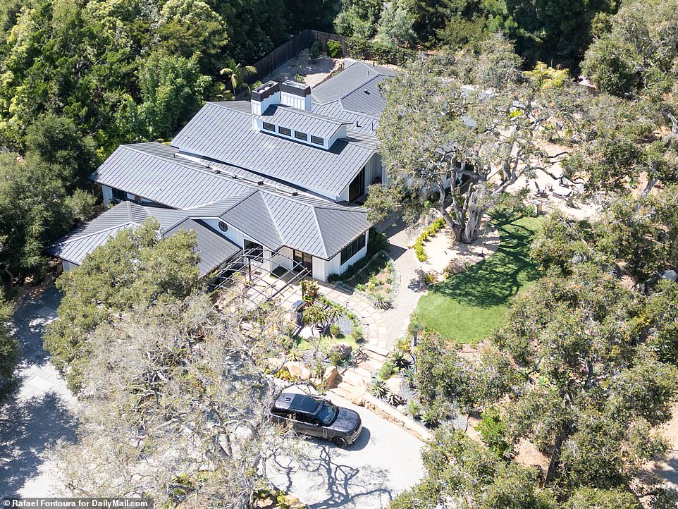 Now: Christine Baumgartner's Range Rover SUV is parked here in front of her new rental home in a leafy part of Montecito