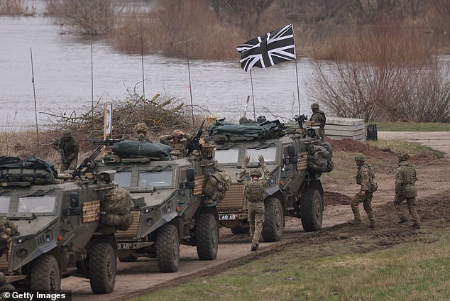 British troops in Foxhound vehicles arrive after crossing the Vistula River as part of NATO's Dragon 24 military exercise in March