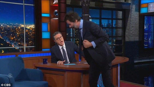 Keanu stood up and walked in front of Stephen's desk to show how he fell and how his knee failed him