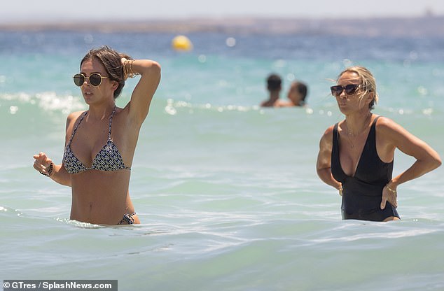 Meanwhile, Louise, who has been married to former England footballer Michael since 2005, looked absolutely sensational in a black plunging swimsuit