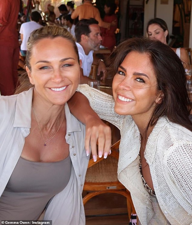 She had a big smile on her face as she settled in to pose for a photo with her mother, who looked gorgeous in a gray swimsuit and white shirt, during a lavish lunch