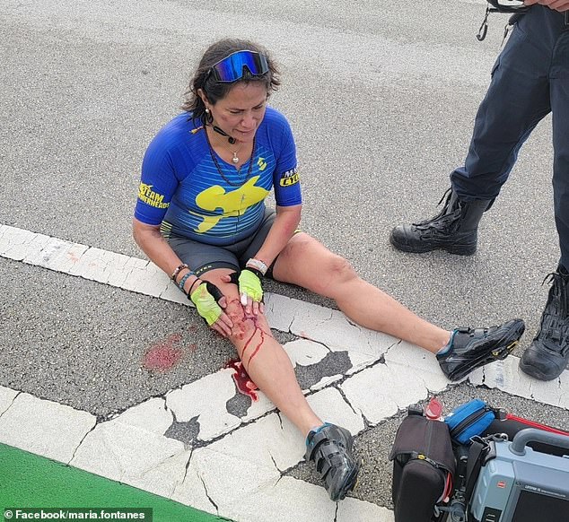 Maria Galleguillo, 56, immediately fell off her bike after Cobb punched her in the face. She can be seen crying as she holds her bloodied knee