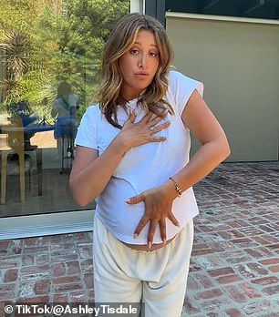 Ashley (pictured) uploaded a clip of herself dancing to Charli XCX's Apple, captioning it: 'I may be pregnant but I'm still having a shitty summer'