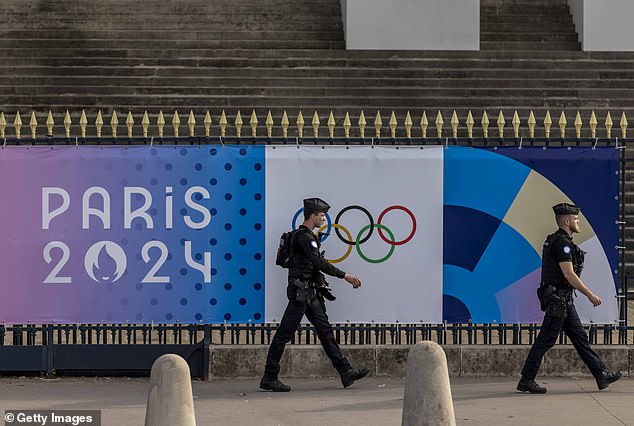 Police guard the street ahead of the Paris 2024 Olympic Games, which begin on Friday