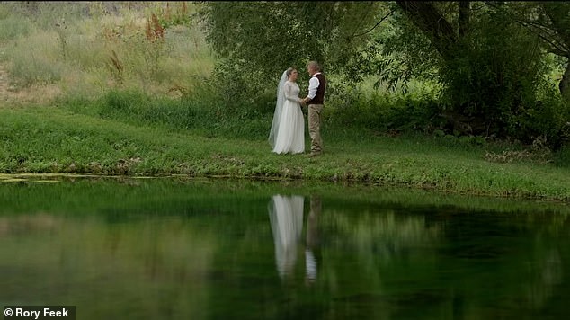 The couple looked at each other as they shared a moment by a tranquil pond