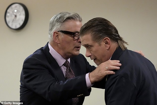 Alec (left) embraces his brother, actor Stephen, during his hearing in Santa Fe County Superior Court on July 10 in Santa Fe, New Mexico