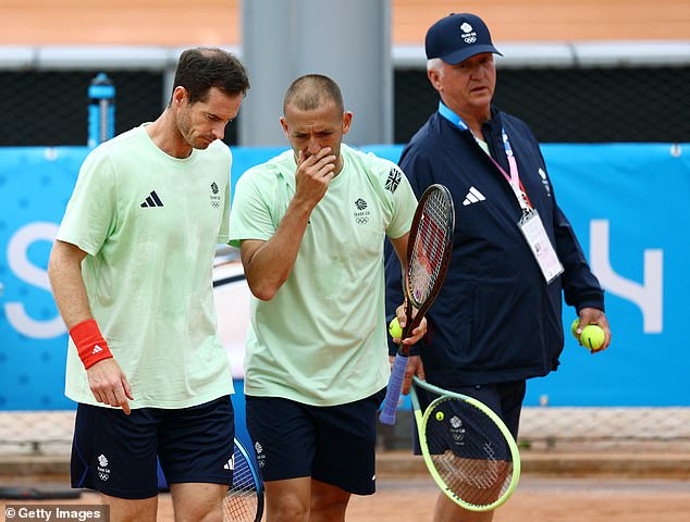 Sir Andy pictured with Evans as the two appear to discuss tactics ahead of the tournament