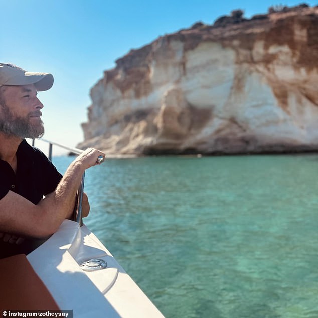 A candid snap was also shown of her husband Hamish, 42, looking out over crystal clear waters from a boat. Pictured: Hamish Blake