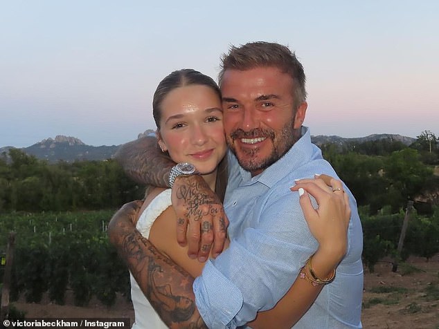 David then posed for an adorable photo of himself cuddling his daughter Harper, 13, while another selfie showed the couple with proud mother Victoria