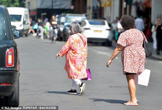 Both mother and daughter carried plastic bags in their hands