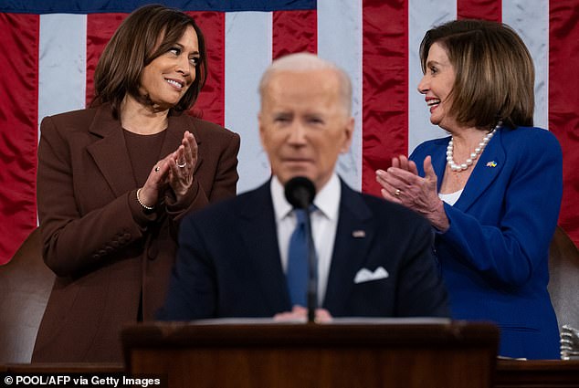 U.S. Vice President Kamala Harris (L) and U.S. House Speaker Nancy Pelosi (D-Calif.) applaud as U.S. President Joe Biden delivers his first State of the Union address at the U.S. Capitol in Washington, D.C., on March 1, 2022.