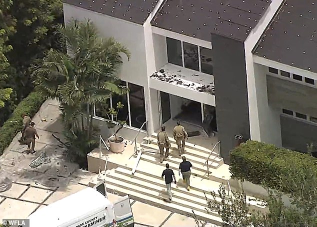 Aerial footage of the aftermath of the raid showed the front doors and windows destroyed by the SWAT team