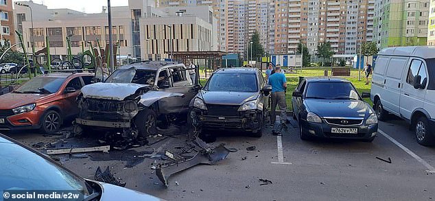 Another view of the debris surrounding the car, which was just meters away from a children's playground (photo above left)