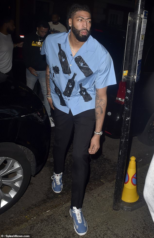 Anthony Davis wore a blue shirt with photos of liquor bottles and matching Prada sneakers