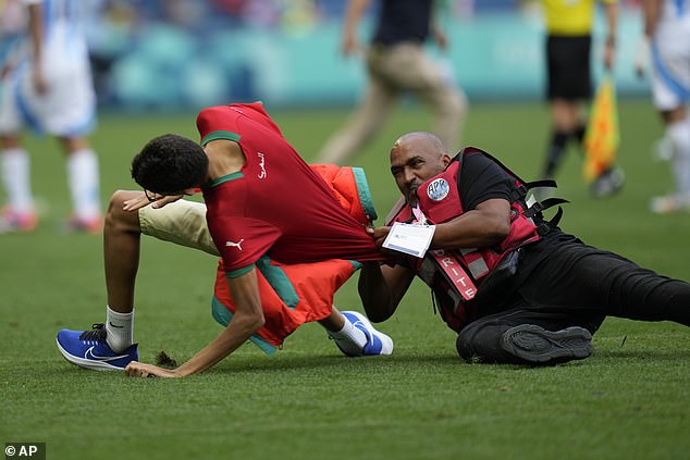 The pitch invasion led to a delay in the match, with the referee eventually blowing the whistle for the end of the game.