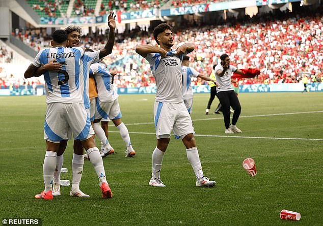 Cups were thrown at Argentina players as their team celebrated Cristian Medina's goal