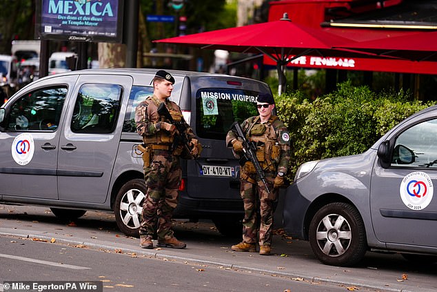 Armed guards at the Plaza de la Bastilla, Paris. The opening ceremony of the Paris 2024 Olympic Games will take place on Friday, July 26, along the River Seine.