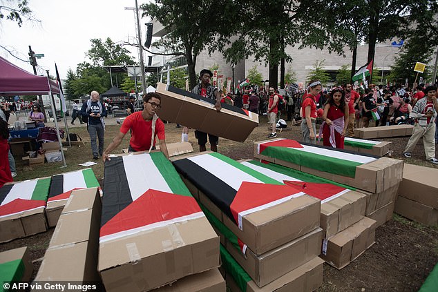 Pro-Palestinian protesters prepare cardboard coffins for a protest before Israeli Prime Minister Benjamin Netanyahu addresses a joint session of Congress