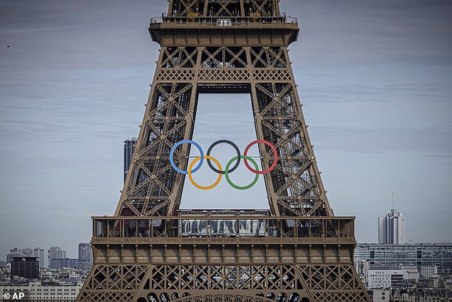 The Olympic rings are on display on the Eiffel Tower, Sunday, July 14, 2024, in Paris