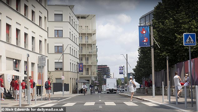 Athletes run through the village in Saint Quen, Paris, ahead of the opening ceremony this week