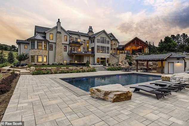 The 'White Deer Estate' is a gem in Littleton, nestled in the foothills, with breathtaking views of red rock formations and the Denver skyline