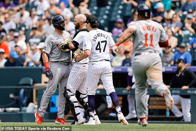 Red Sox catcher Reese McGuire (3) is stopped by Colorado Rockies catcher Jacob Stallings