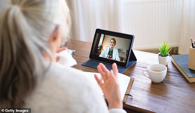 A woman has an appointment with a doctor via video call (stock image)