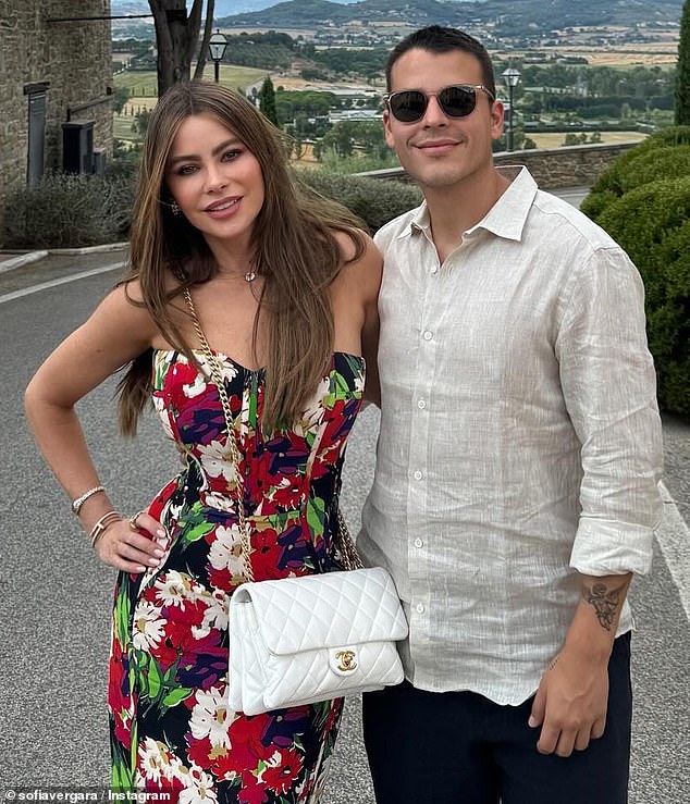 Vergara previously flashed a figure-hugging red floral dress as she posed with the group in front of another gorgeous view