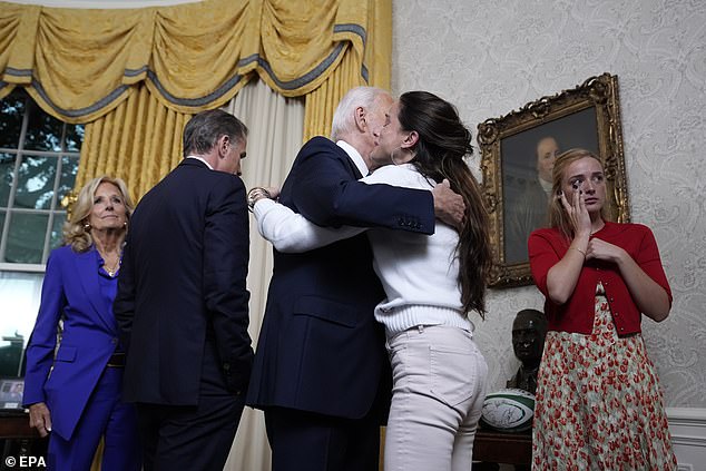 Ashley Biden hugs father Joe Biden as Finnegan Biden wipes away tears