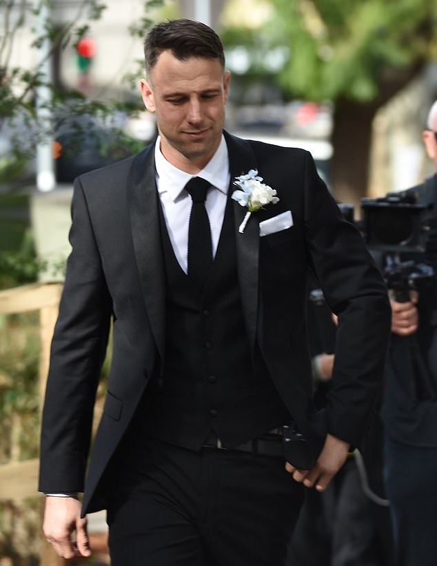 Jeff looked elegant in a black three-piece suit with a white corsage on his lapel as he prepared to meet his bride for the first time