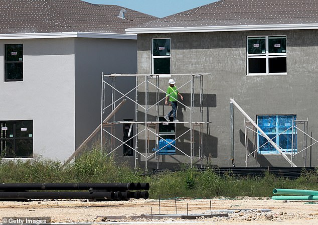 Florida is the third most populous state in the U.S., after California with 39.5 million residents and Texas with 30.5 million residents. (Pictured: A worker helps build a new home in Miami, Florida, on September 22, 2023.)