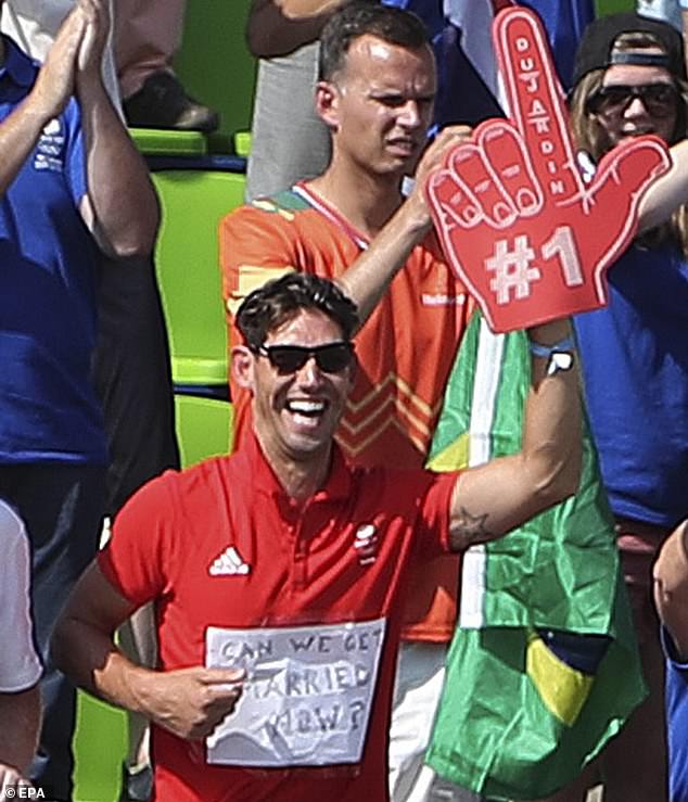 Golding gave an iconic display of love in Brazil, wearing a shirt with the words 'Can we get married?' printed on it as he watched Dujardin win a third gold medal