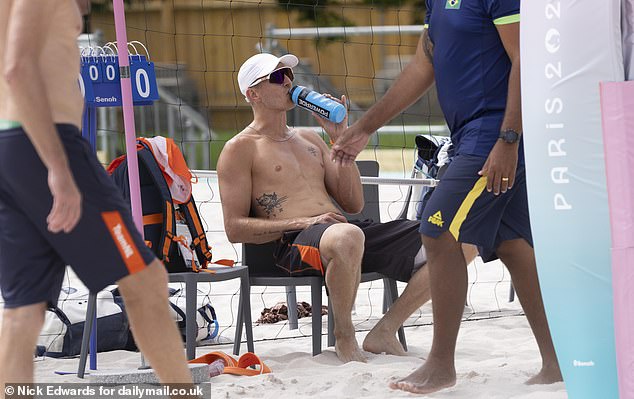 Van de Velde taking a break to drink some electrolytes in the 25 degree afternoon heat during volleyball training