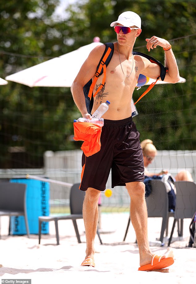 Van de Velde as he leaves the beach volleyball court in the shadow of the Eiffel Tower in Paris