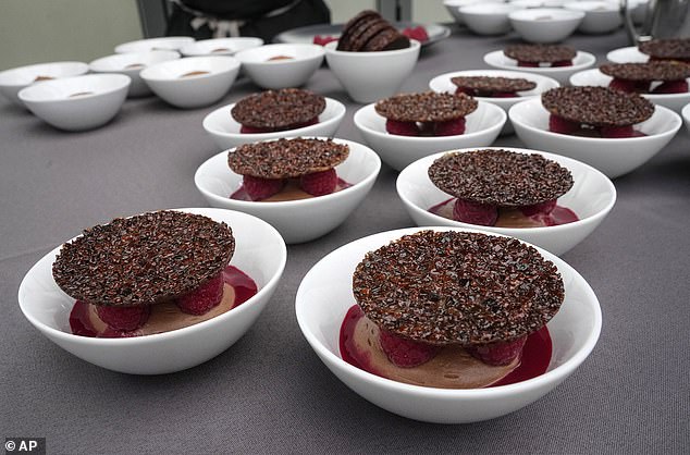 Light chocolate-raspberry mousse and crispy tuile dishes by French chef Stephane Chicheri, CEO of Sodexo Live, are on display. The company has been tasked with serving 40,000 meals a day in the Olympic Village