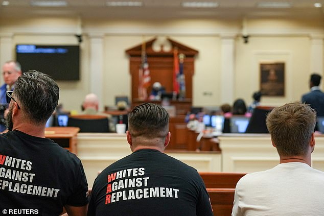 Members of the hate group Goyim Defense League sit during a city council meeting in Nashville, Tennessee, July 16, 2024