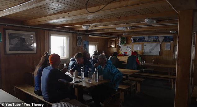 They quickly enter the hut to take shelter from the bad weather and feast on the hut's famous pizzas.