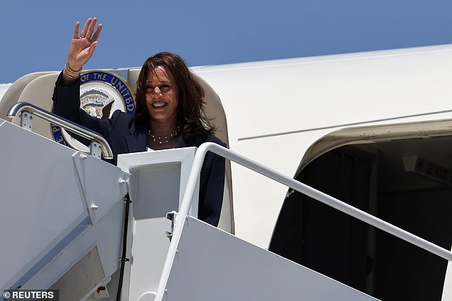 US Vice President Kamala Harris waves as she boards Air Force Two