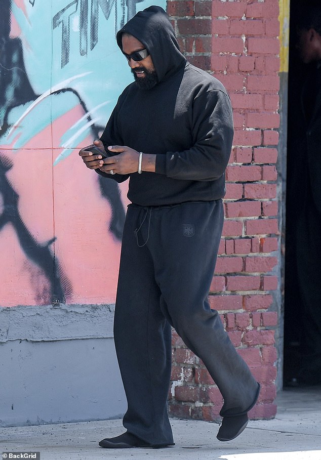 West - also known as Ye - stepped out for lunch with his wife and opted for an all-black ensemble consisting of a black hoodie and comfortable sweatpants