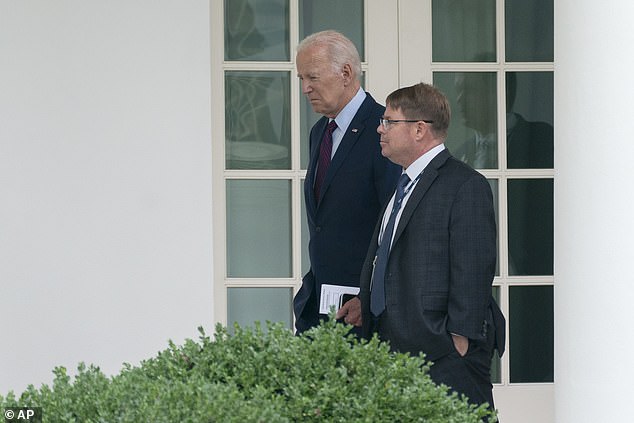 Biden walks with O'Connor along the Colonnade at the White House in August 2023