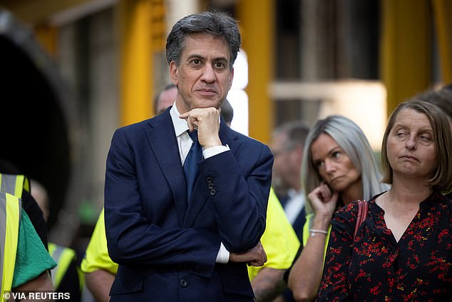 Ed Miliband grins during speeches during visit to Cheshire yesterday