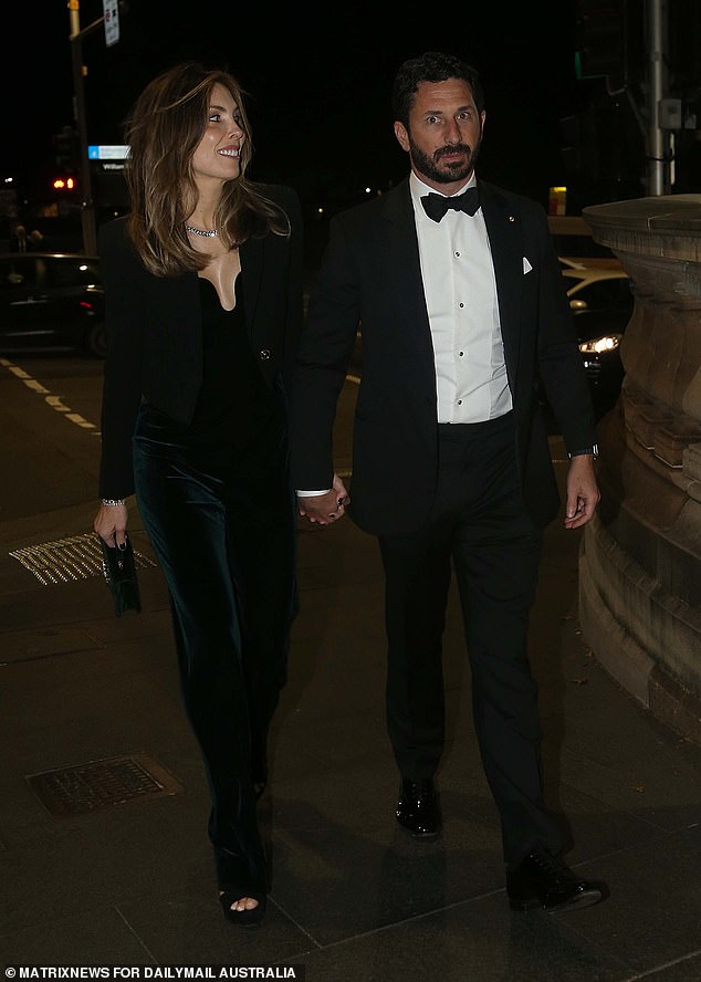 Claire looked dashing in a $400 black velvet jumpsuit from NBD, featuring a U-shaped bust that showed off her ample cleavage