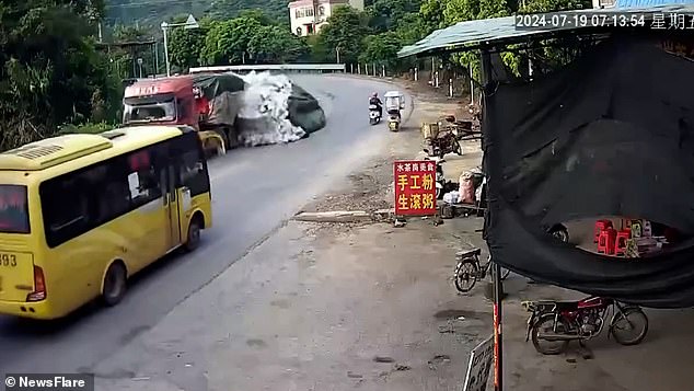 Hilarious footage shows the moment a truck took a turn too fast in Shuicheng County, Liupanshui, Guizhou, causing its cargo of beer to spill out