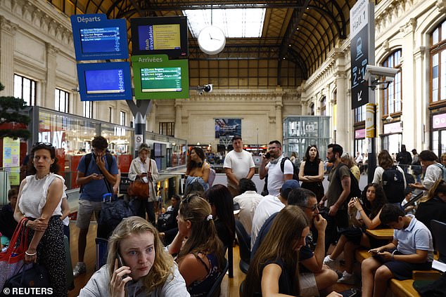 Passengers at Gare de Bordeaux Saint-Jean station after threats against France's high-speed TGV network, ahead of the opening ceremony of the Paris 2024 Olympic Games