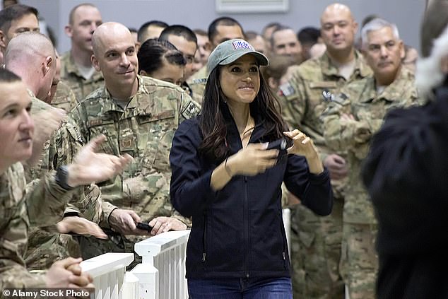 Meghan toured with the USO in December 2014. During the tour, she visited American airmen at RAF Mildenhall in Suffolk, other bases in Europe, and Bagram Airport in Afghanistan. The Duchess, center, is pictured with service members during the USO Holiday troop visit at Bagram Air Field on December 9, 2014 in Bagram, Afghanistan