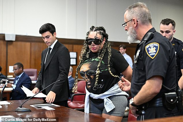 Clifford was then handcuffed and led out of the courtroom, but not before giving the press who were present and taking photos the middle finger.