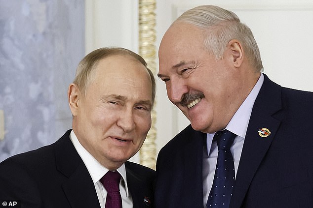 Vladimir Putin is pictured with Belarusian President Alexander Lukashenko, right, during a meeting of the Supreme Council of the Union State in St. Petersburg, Russia, earlier this year