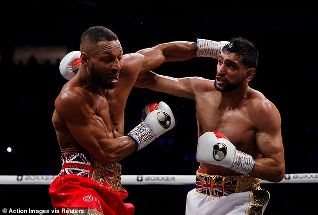 Froch was referring to Khan's (right) two-year ban after testing positive for a banned substance following his defeat to Kell Brook in February 2022 (pictured: Khan during his fight with Brook)