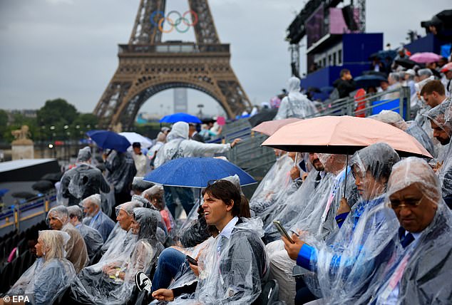 Torrential rain in Paris disrupted the opening ceremony, with many spectators wearing ponchos and umbrellas