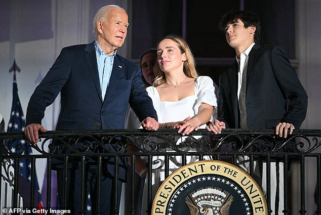 Biden (left) and grandchildren Finnegan Biden and Robert Hunter Biden II (right) watch the fireworks on Independence Day